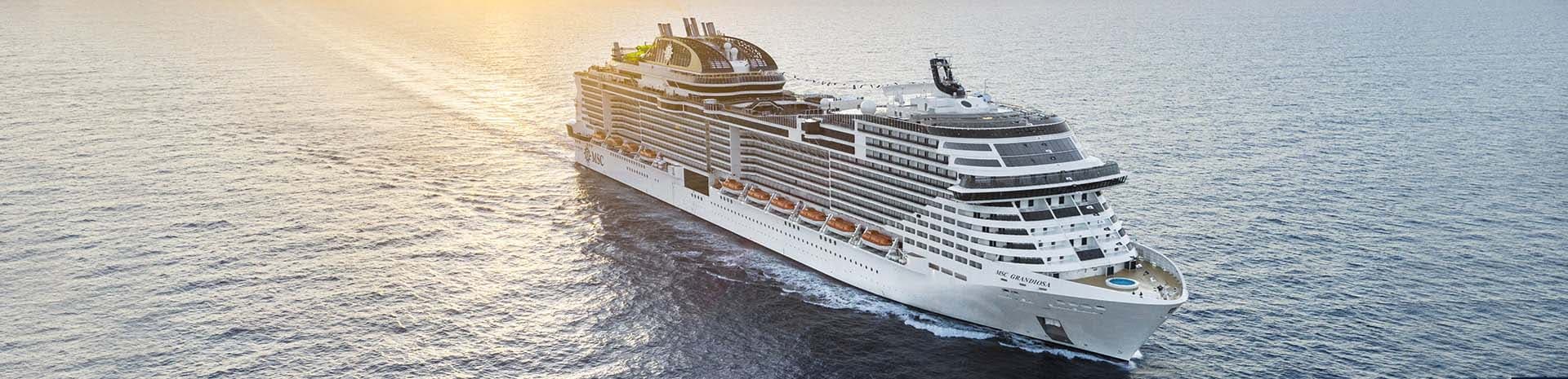 A luxury MSC cruise ship sailing into the sunset | MSC Cruises A luxury MSC cruise ship sailing into the sunset | MSC Cruises