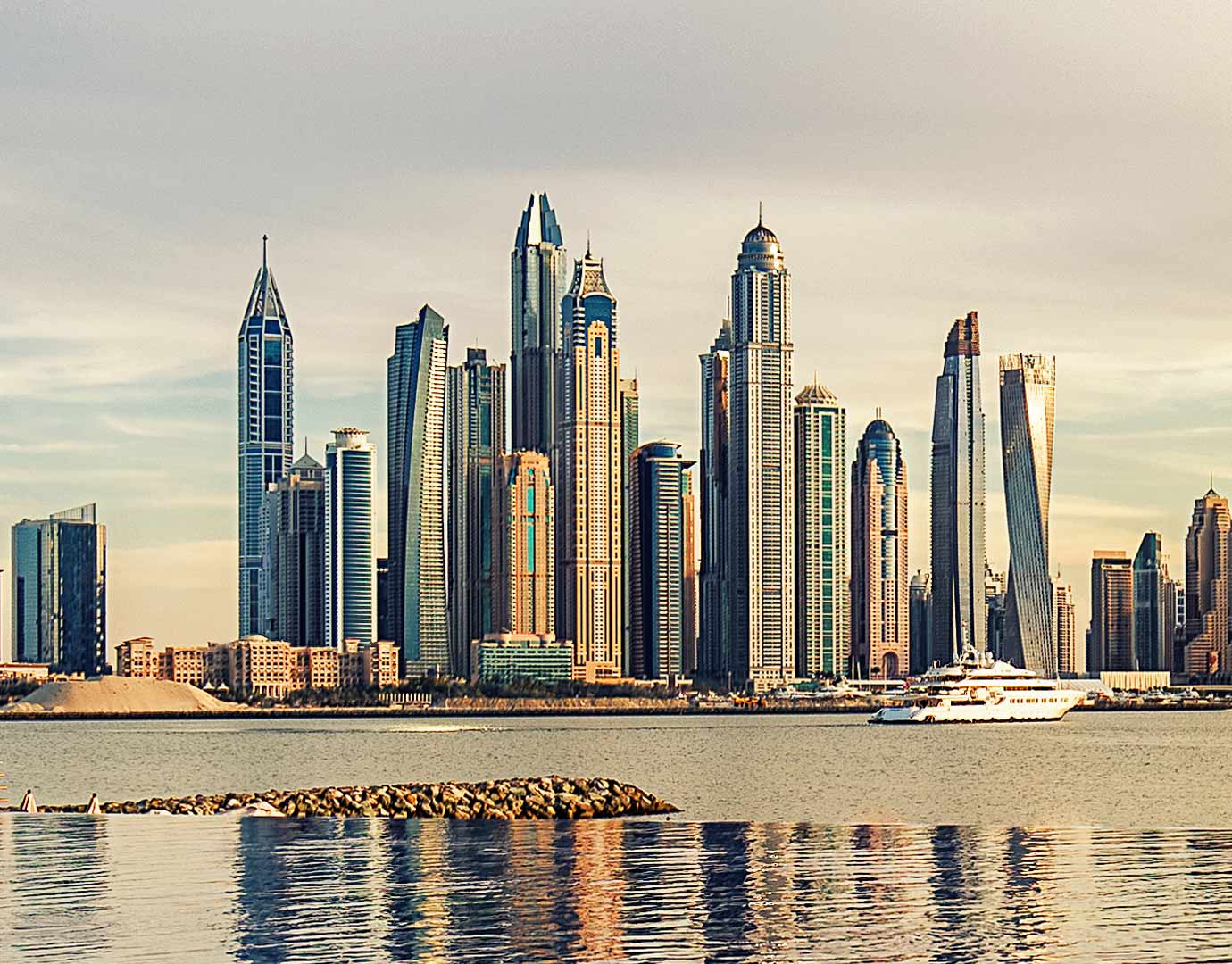 A luxury cruise ship near Dubai Marina's iconic skyline | MSC Cruises