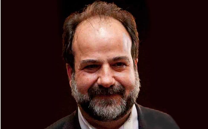 A person in formal attire on a dark background | MSC Cruises A person in formal attire on a dark background | MSC Cruises