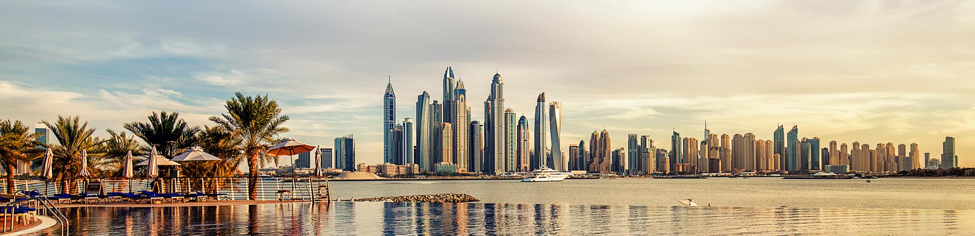 Dubai skyline with modern skyscrapers and waterfront view at sunset | MSC Cruises Dubai skyline with modern skyscrapers and waterfront view at sunset | MSC Cruises