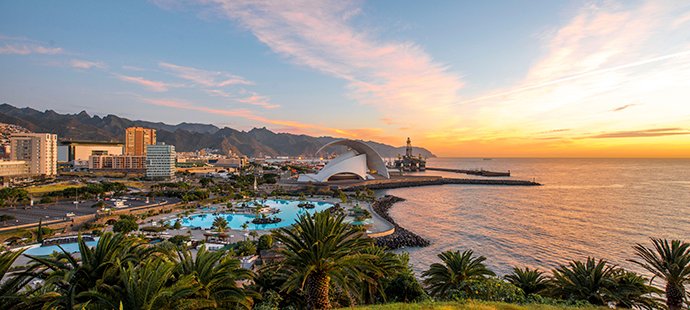 Santa Cruz de Tenerife waterfront with lush gardens, the Auditorio de Tenerife, and ocean views at sunset | MSC Cruises