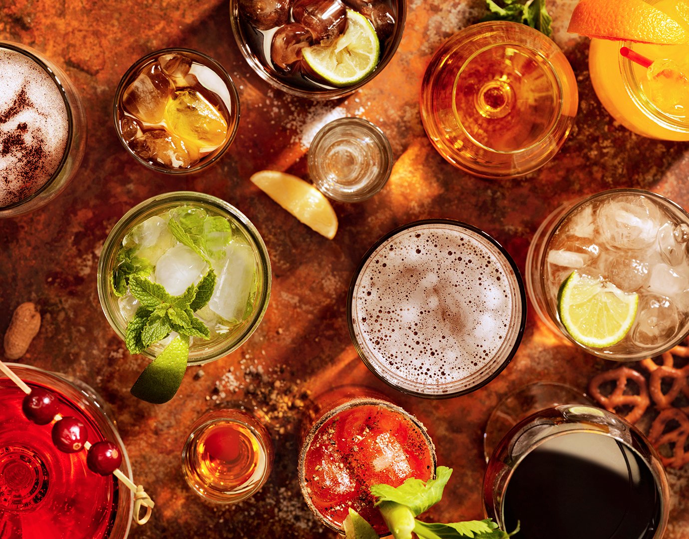 Assorted colorful cocktails and drinks on a rustic table | MSC Cruises Assorted colorful cocktails and drinks on a rustic table | MSC Cruises
