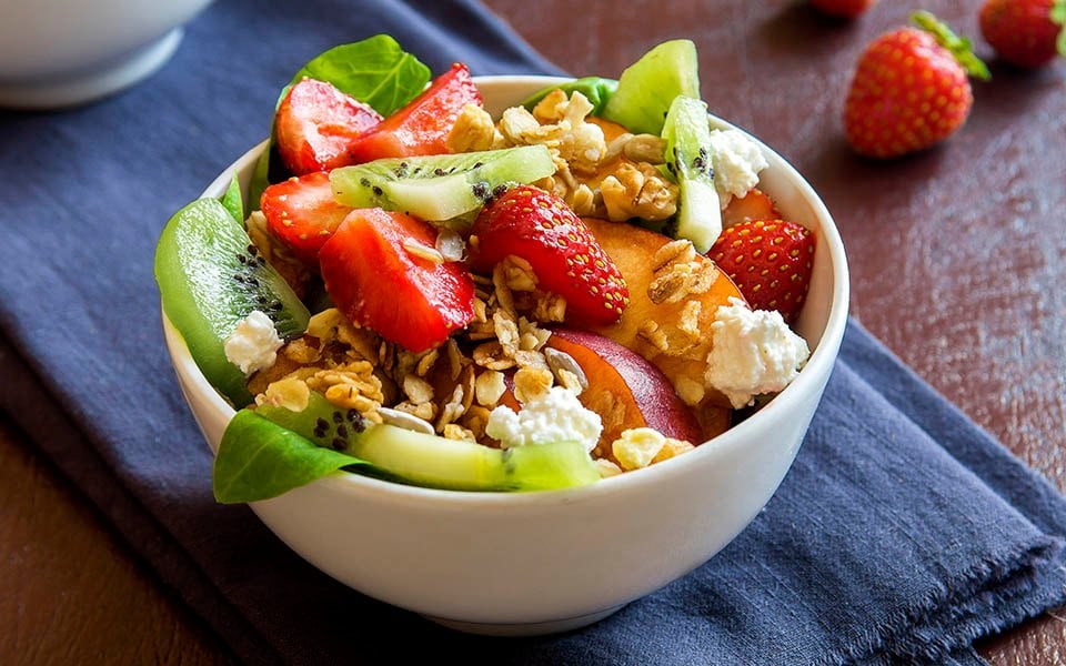 Fresh fruit and granola bowl with strawberries, kiwi, and cream cheese, served onboard | MSC Cruises Fresh fruit and granola bowl with strawberries, kiwi, and cream cheese, served onboard | MSC Cruises