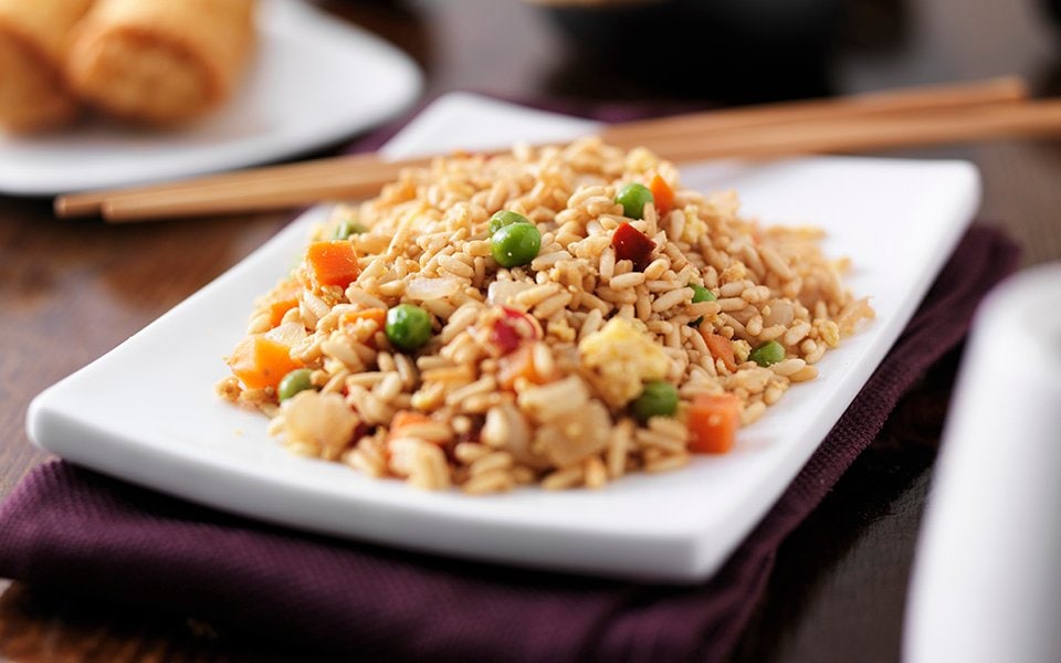 A plate of vegetable fried rice served on a cruise dining table | MSC Cruises A plate of vegetable fried rice served on a cruise dining table | MSC Cruises