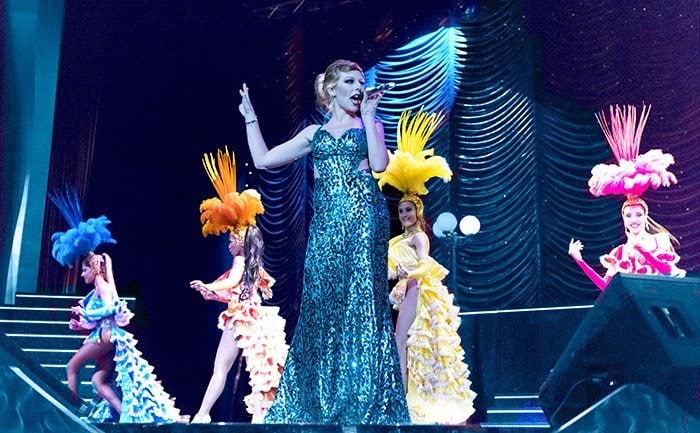 A dazzling stage performance with dancers in vibrant costumes onboard | MSC Cruises A dazzling stage performance with dancers in vibrant costumes onboard | MSC Cruises