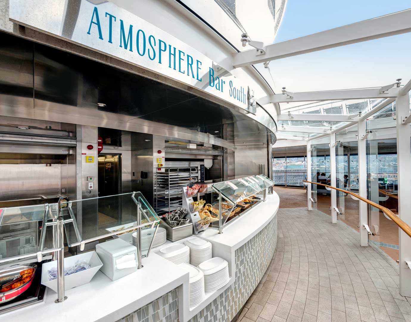 Atmosphere Bar South on an MSC cruise ship with food display and ocean views | MSC Cruises