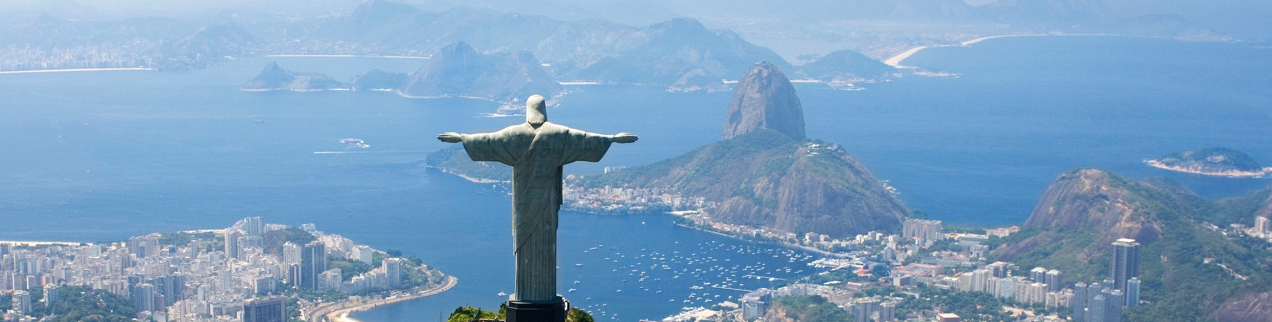 The Christ the Redeemer statue overlooking Rio de Janeiro and Sugarloaf Mountain | MSC Cruises The Christ the Redeemer statue overlooking Rio de Janeiro and Sugarloaf Mountain | MSC Cruises